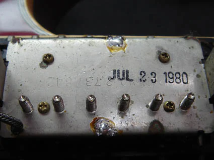 Back of neck pickup dated July 23, 1980
