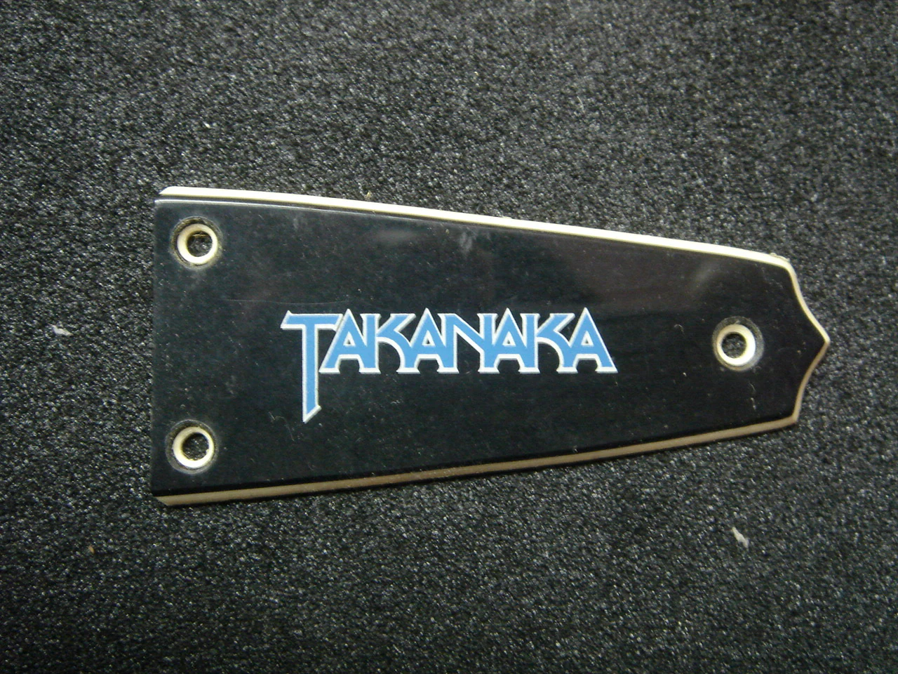 Black truss rod cover with TAKANAKA logo
