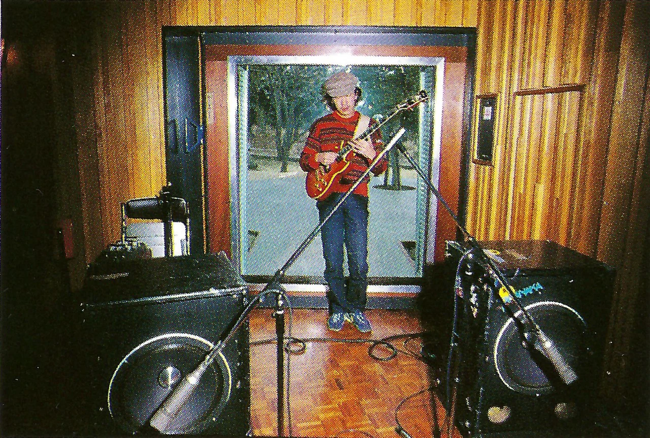 Takanaka standing with the red SG1000 during a Rainbow Goblins recording session
